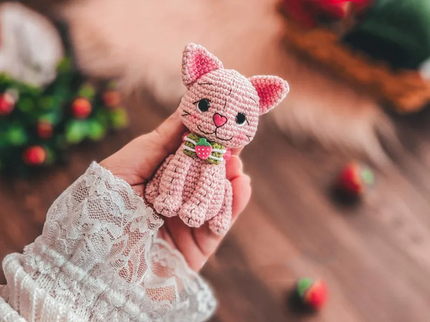 Doll dressed in strawberry costume