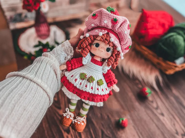 Doll dressed in strawberry costume